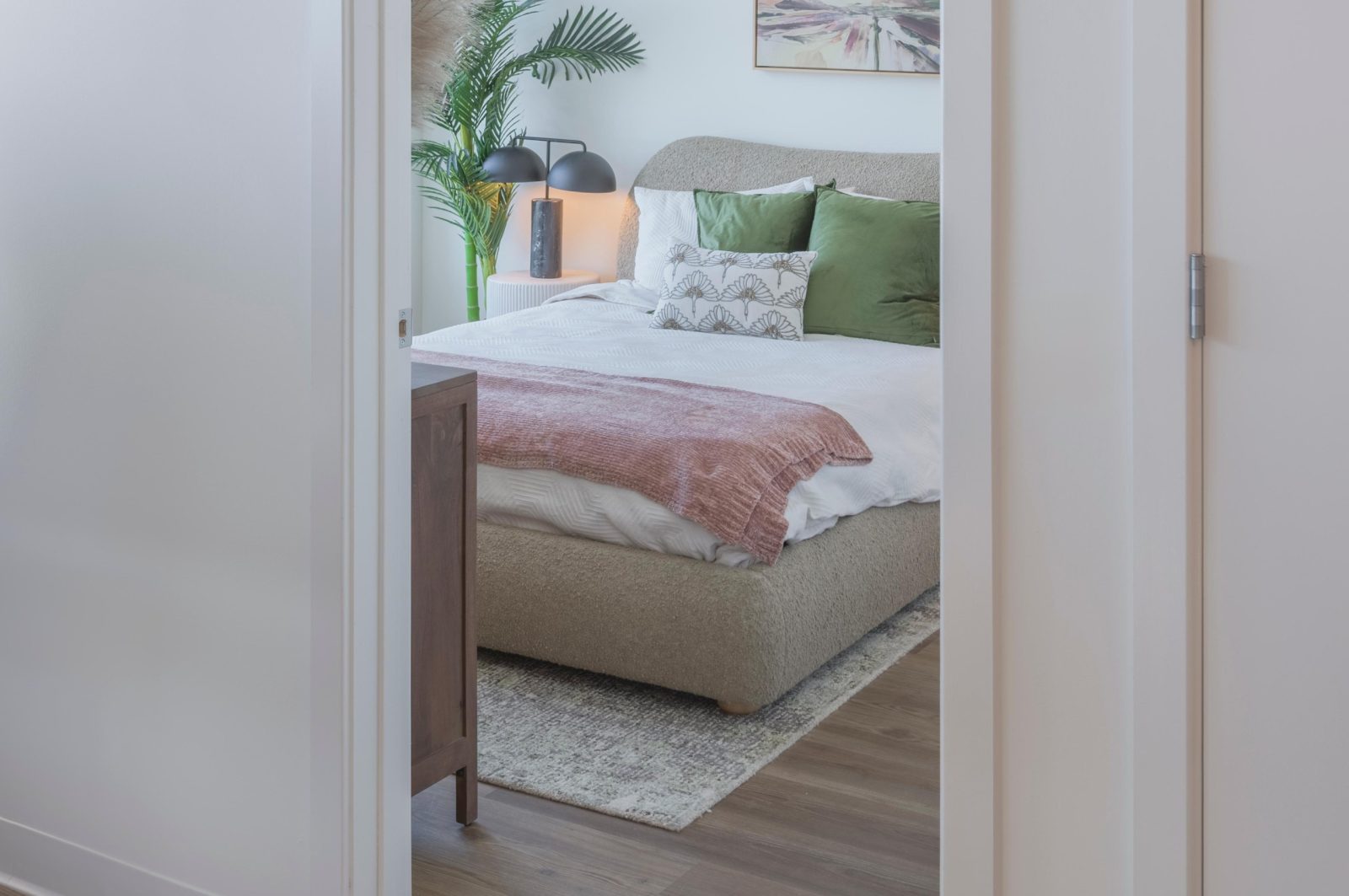 Bedroom entrance with window view.