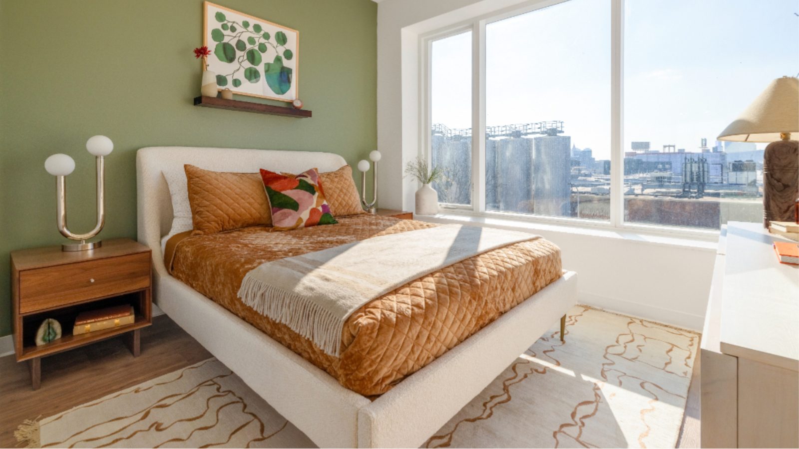 Bedroom with green accent wall.