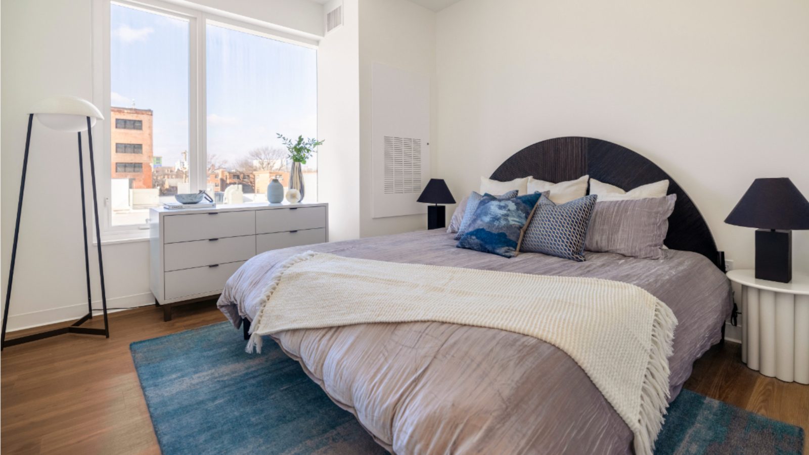 Bright bedroom with neutral decor.